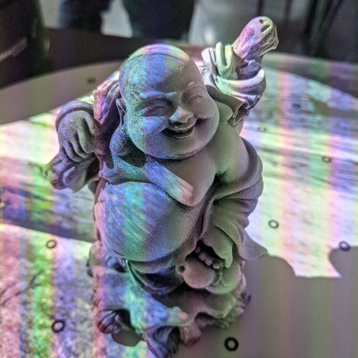 3D Printable laughing buddha figure by Tomasz Zamojski