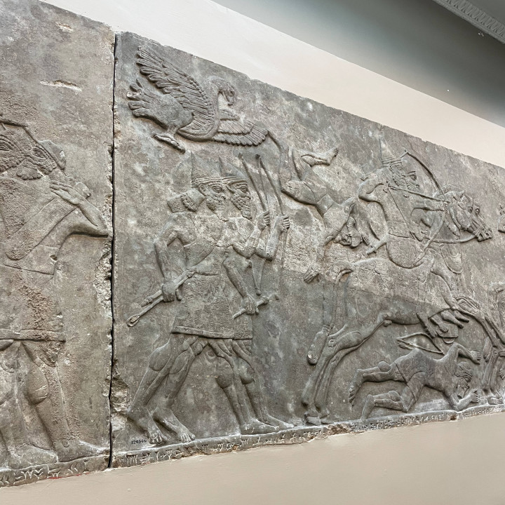 Crossing a river Assyrian relief image