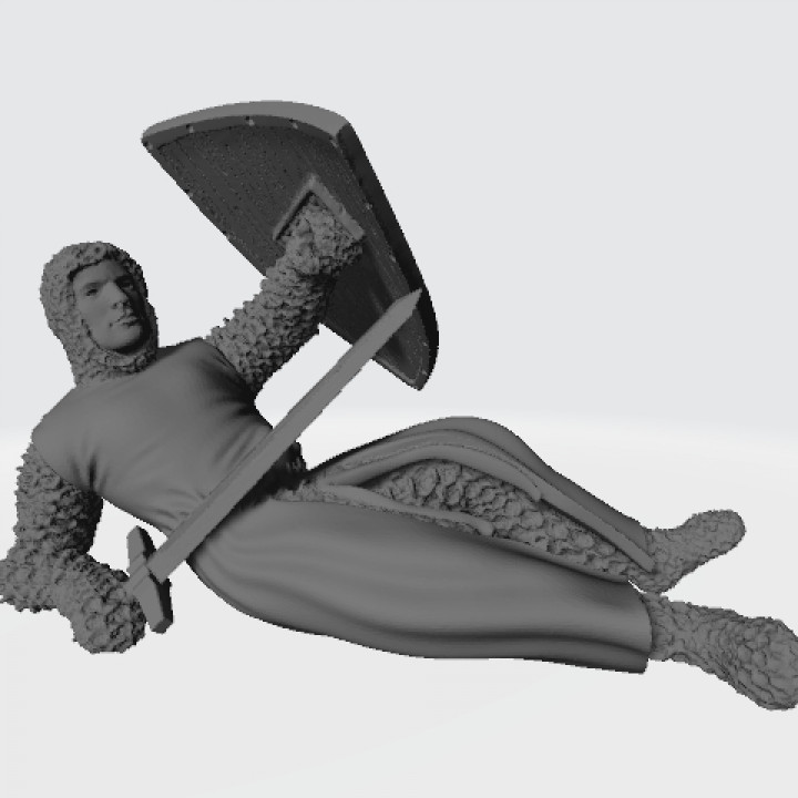 Medieval wounded knight on the ground with sword and shield image