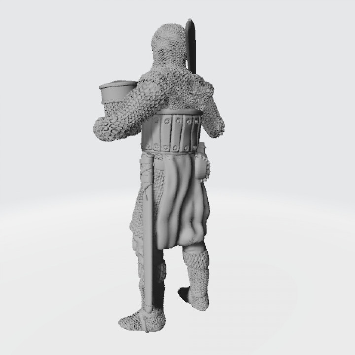 Medieval knight standing with sword on shoulder image