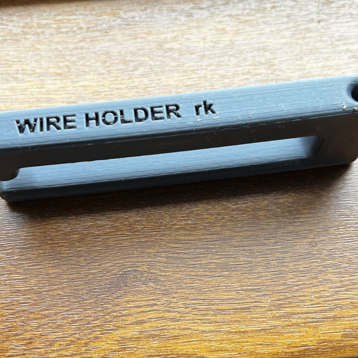 Under table wire holder image