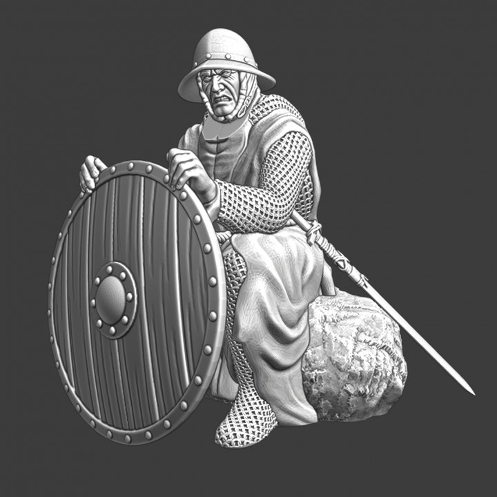 Medieval infantryman sitting with shield at campfire image