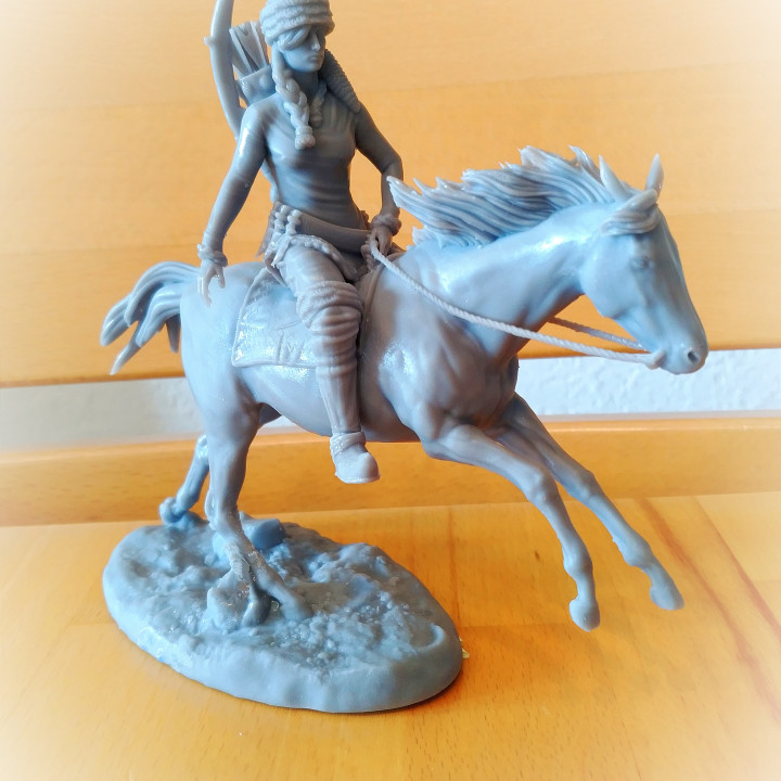 Female Trapper on horseback image