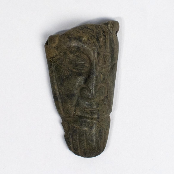 Stone carving of the head of a man