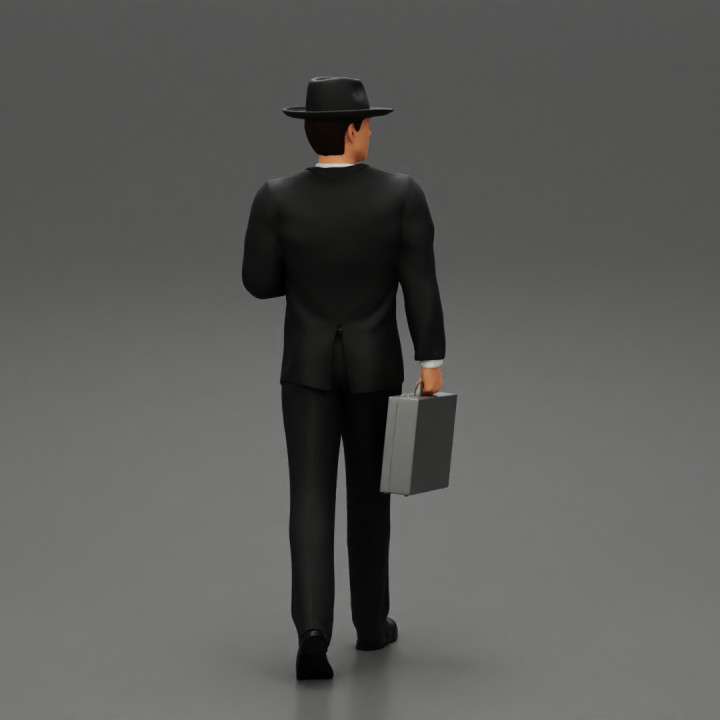Businessman Walking and Holding His Briefcase image