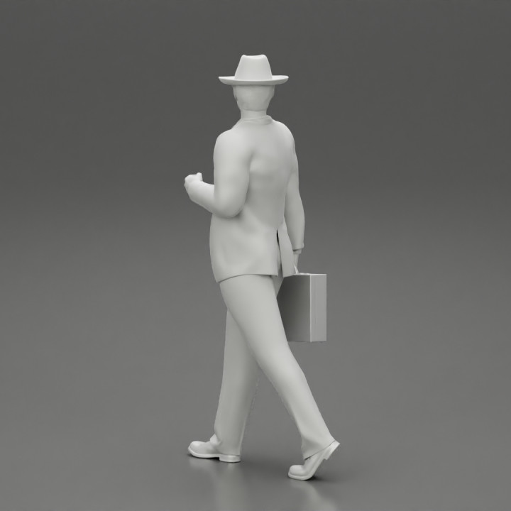 Businessman Walking and Holding His Briefcase image