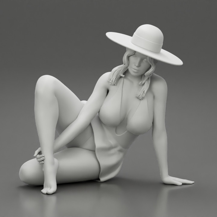 young woman in a summer suit and hat sitting