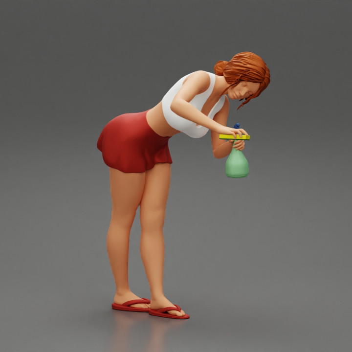sexy girl cleaning in sponge and cleaning bottle image