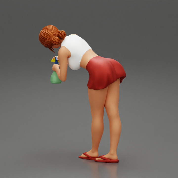 sexy girl cleaning in sponge and cleaning bottle image