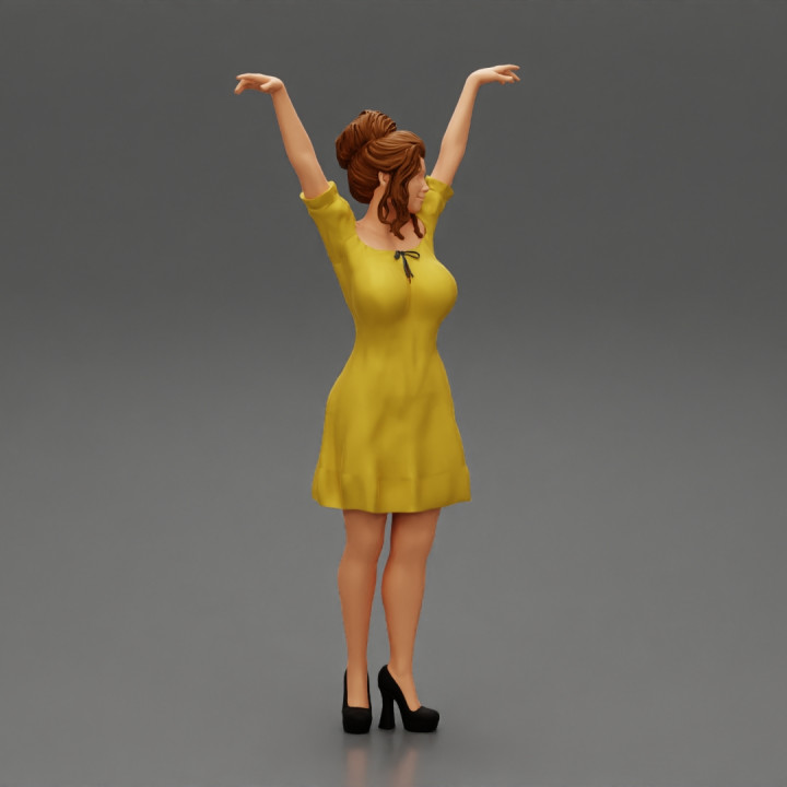 Sexy young girl in a dress raised her hands up image