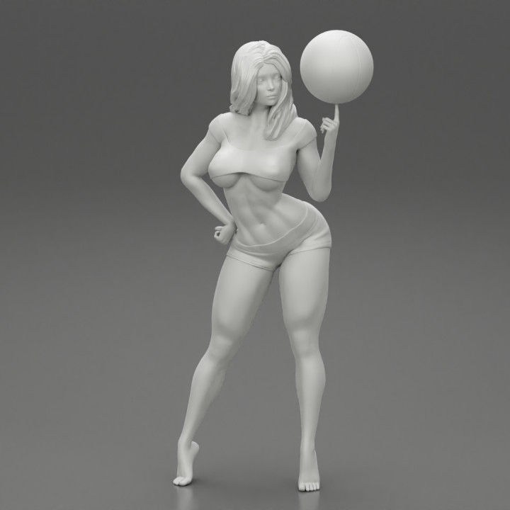 Beautiful Young Sporty Girl Playing With the Ball on the Basketball