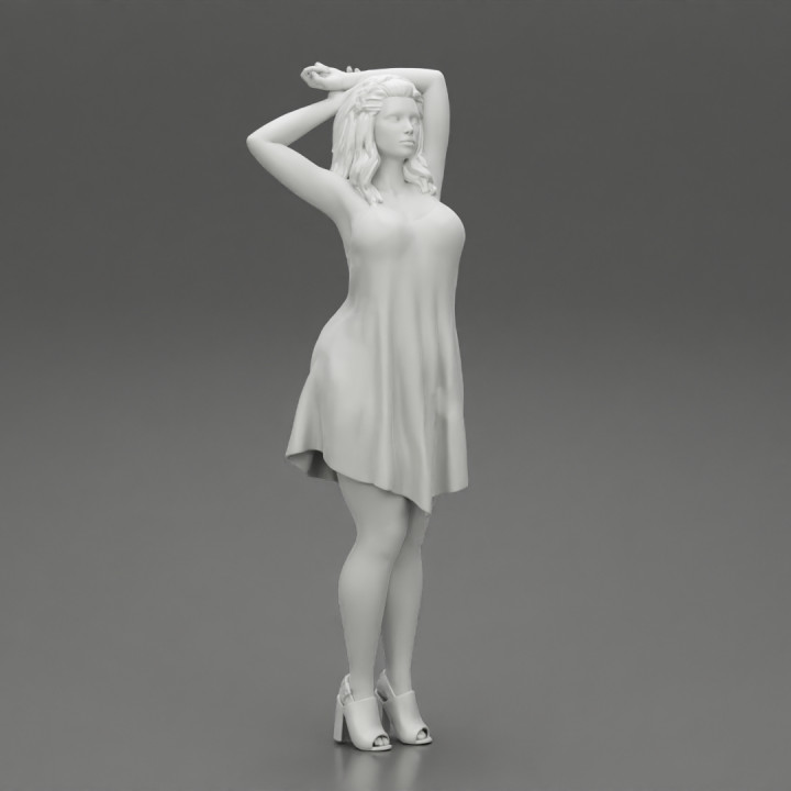 Beautiful woman standing in Dress and put her hands on head