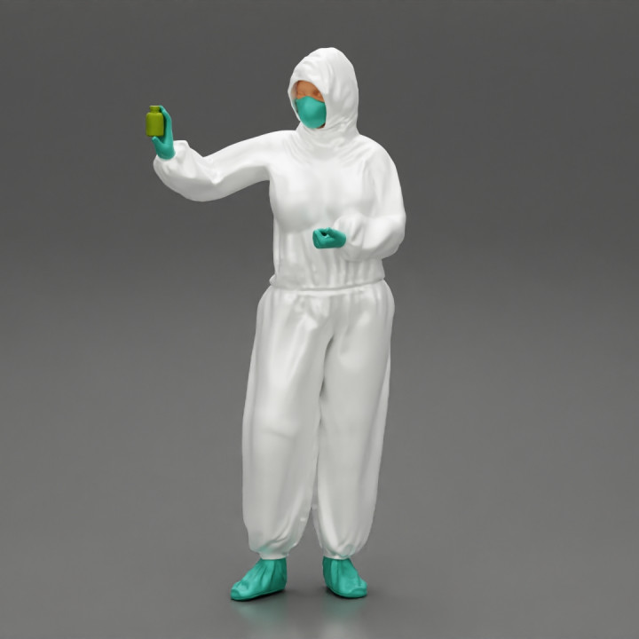 woman wearing antivirus suit standing and holding a bottle vaccin image