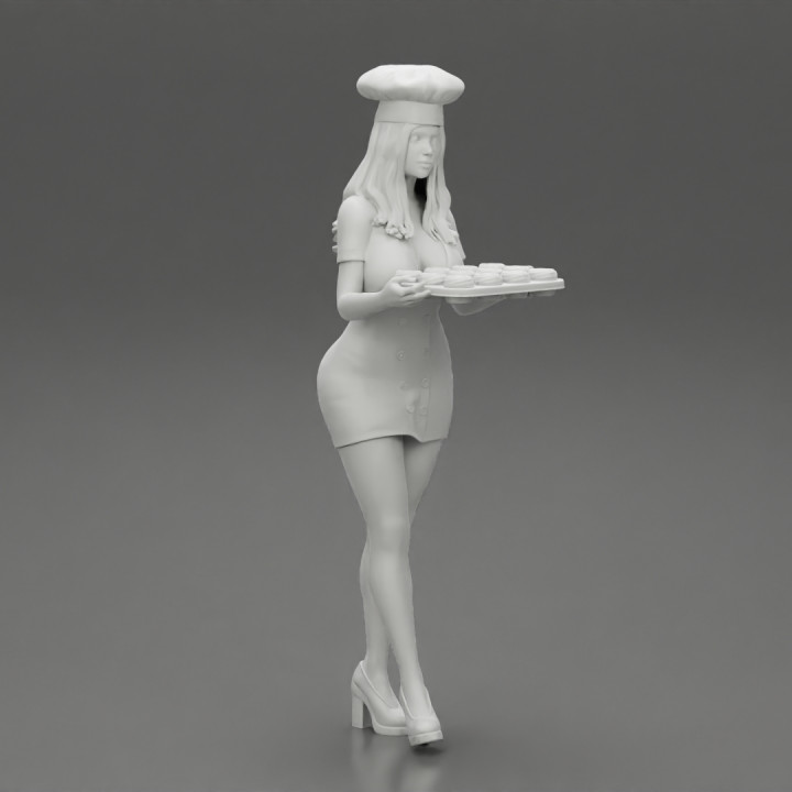 Chef woman carrying tray of Cupcakes