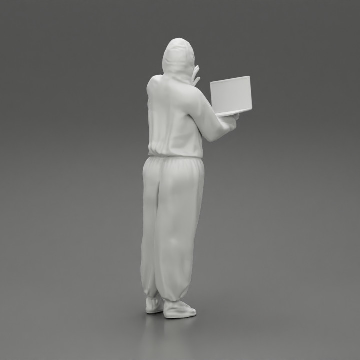 woman wearing antivirus suit standing and holding a laptop