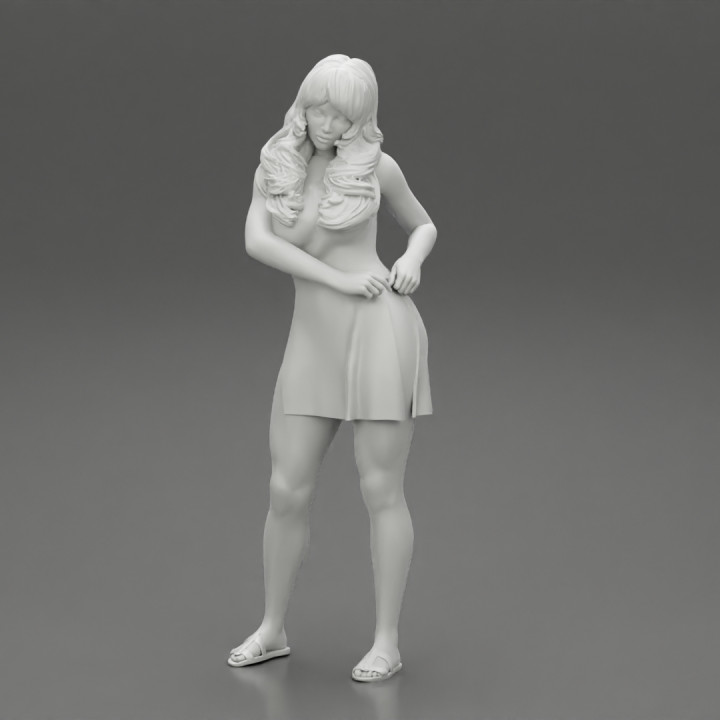 Fashion Girl in Dress with long hair put hands on hip
