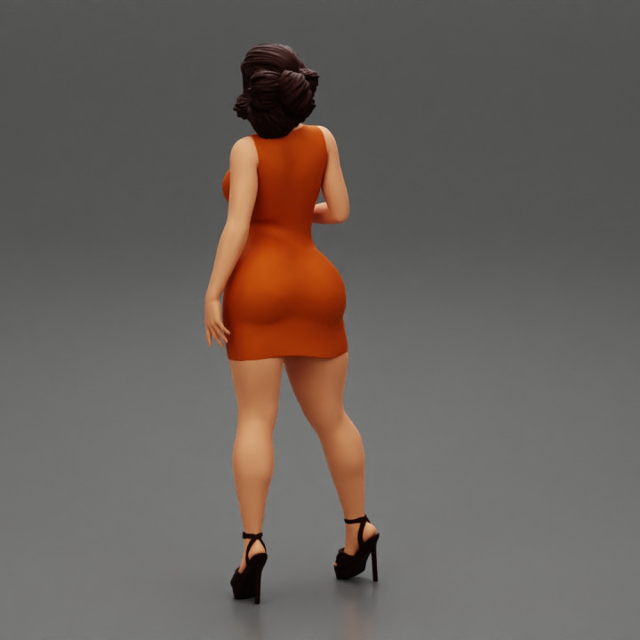 Beautiful Woman Mini Dress and high heels Posing image