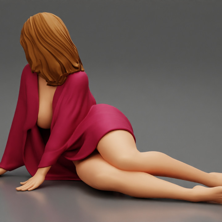 Beautiful half nude woman lying wearing cover image