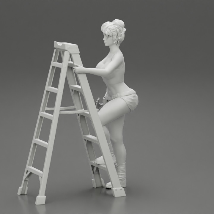 Young girl mechanic climbing the ladder image
