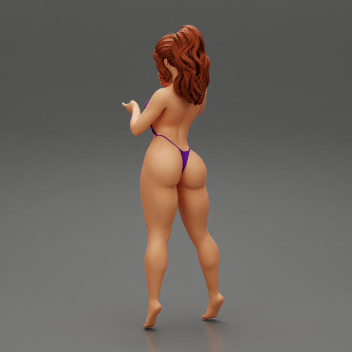 Sexy Woman in  Micro Bikini Bra Mini Thong Slingshot image