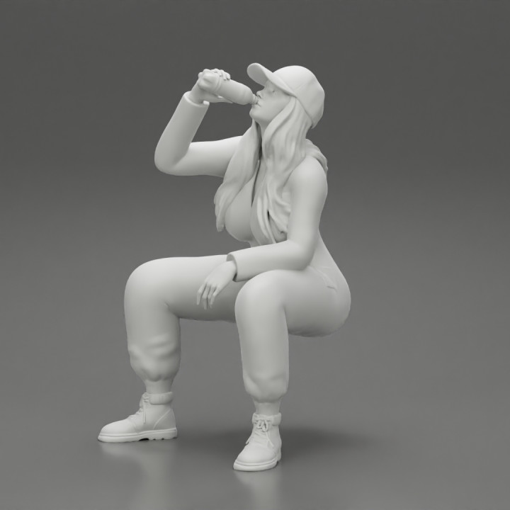 mechanic girl sitting and drinking water in suit and cap image