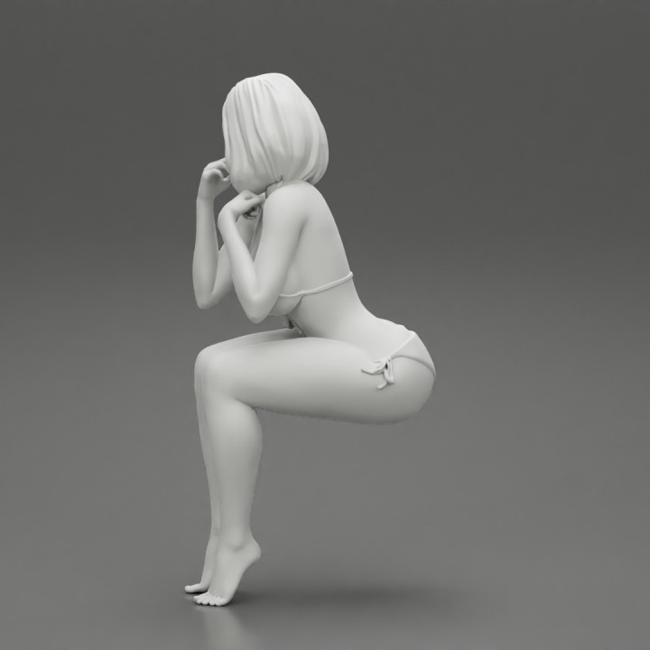 Sexy girl in bikini sitting image