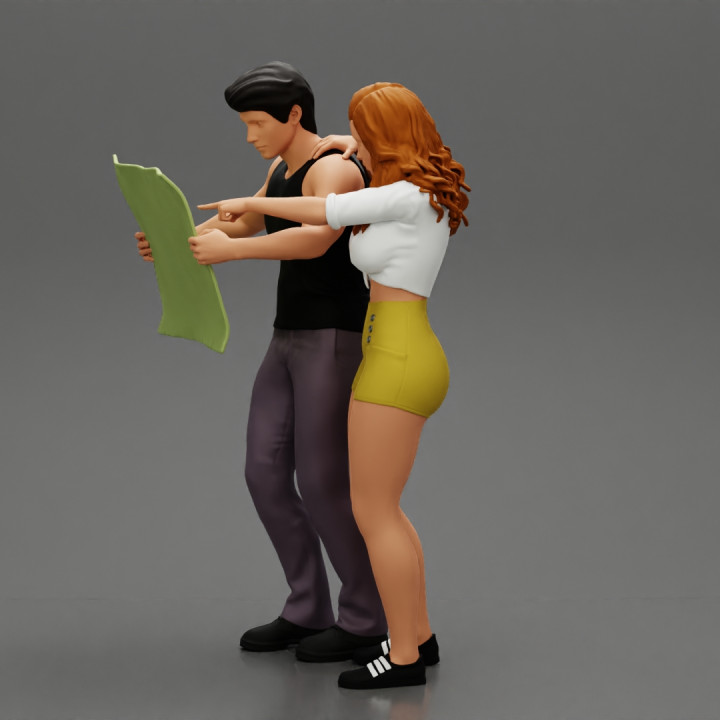 2 models - travel Man Holding Map  with Travel woman in short pointing her next destination image