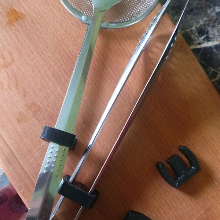 Fixing device for various kitchen tongs image