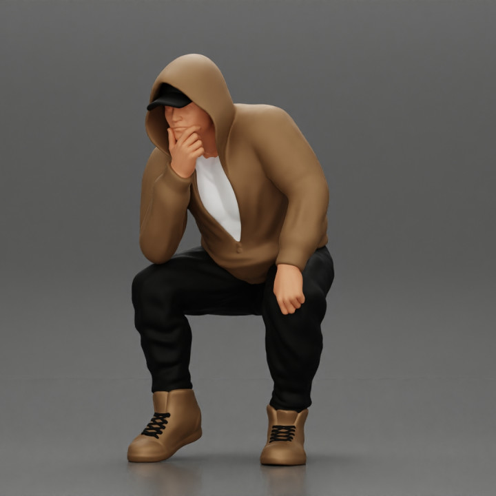 Young Gangster Man With Hoodie Sitting and thinking image