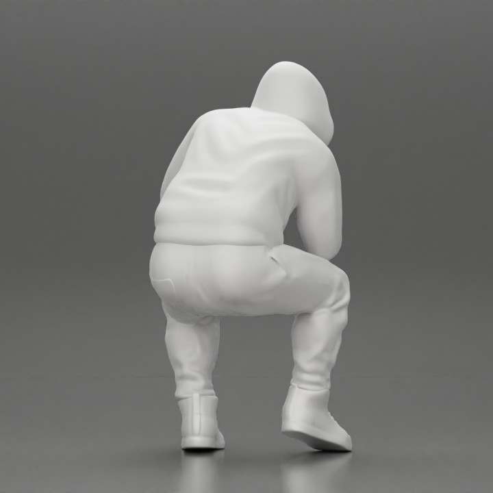 Young Gangster Man With Hoodie Sitting and thinking