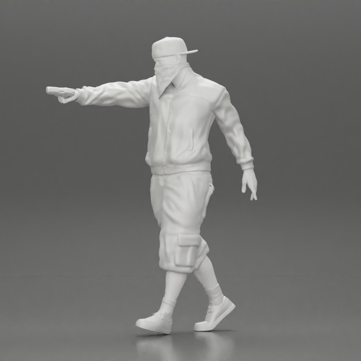 gangster homie in mask walking and holding gun sideways