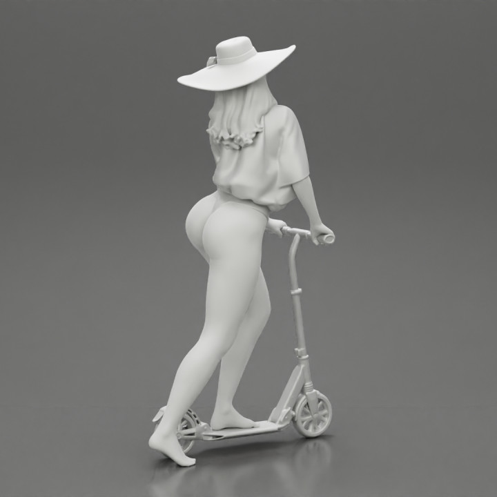 Sexy Woman Riding Electric Scooter on the beach Wearing onepice and hat image
