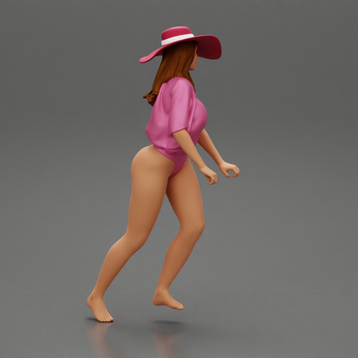 Sexy Woman Riding Electric Scooter on the beach Wearing onepice and hat image
