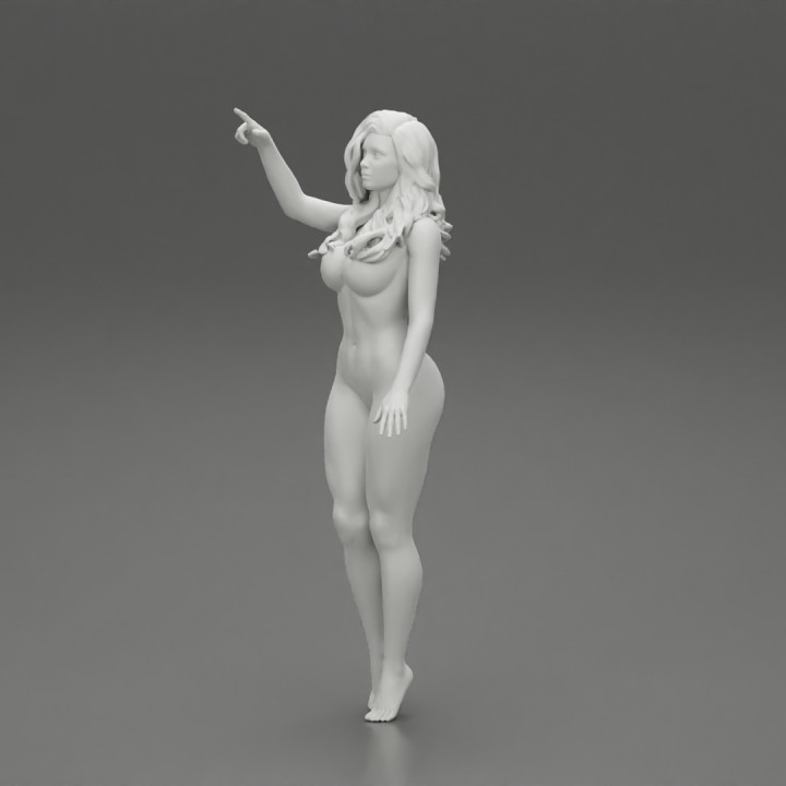 Naked woman standing with her hand indicating