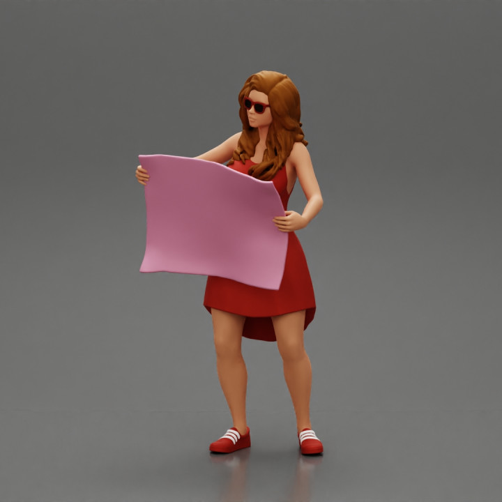 travel woman in dress with sun glasses holding a map and looking to the map image