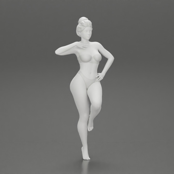 Sexy Woman In bikini posing and Standing On One Leg image