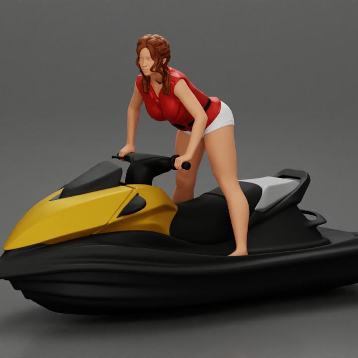 Beautiful girl riding standing up on a speeding jetski image