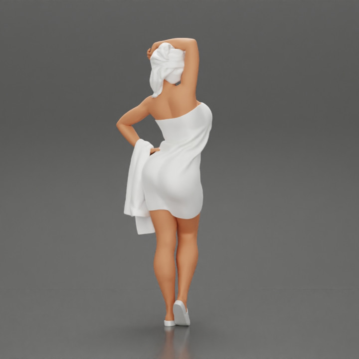 Sexy woman after shower wearing bathrobe holding bath towel image