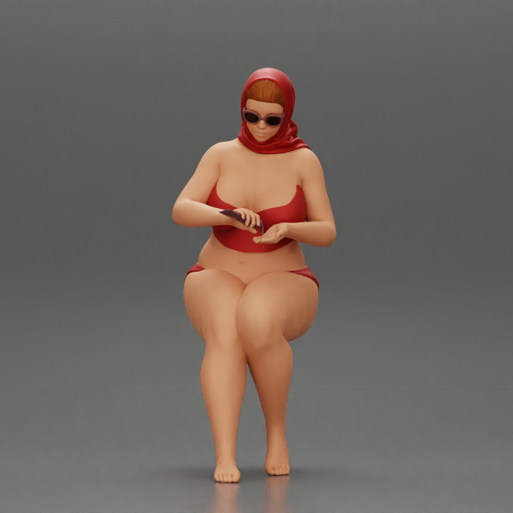 sexy fat woman in bikini summer scarf in the beach putting sunscreen image