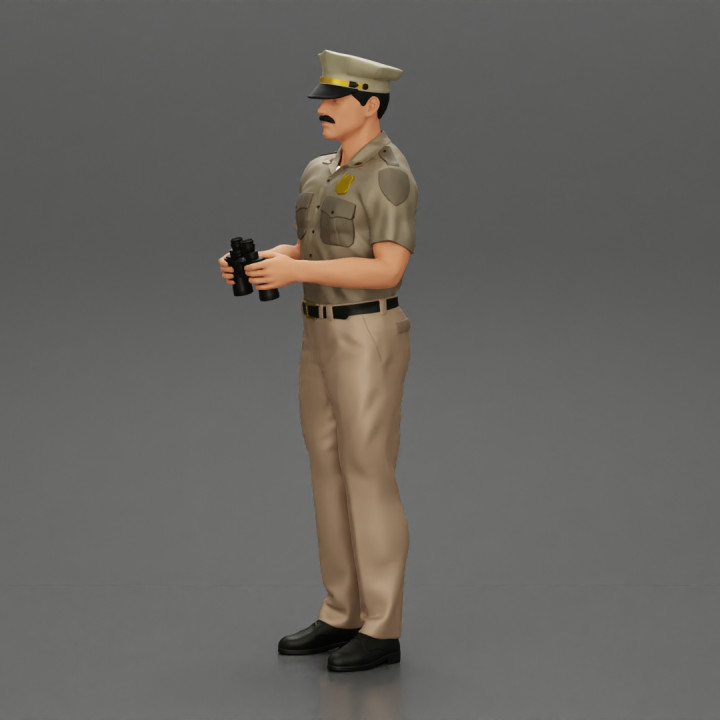 officer holding binoculars image