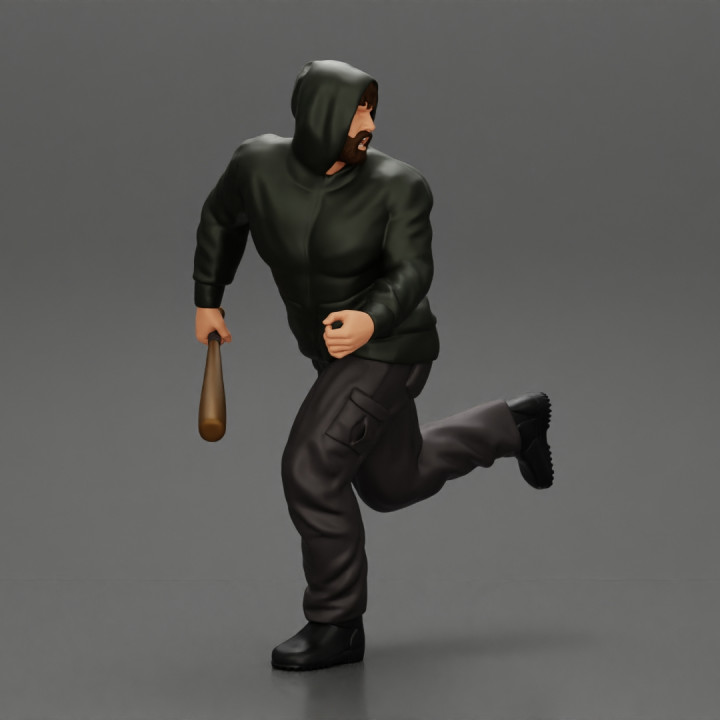 gangster man in hoodie fears running and holds a baseball bat image