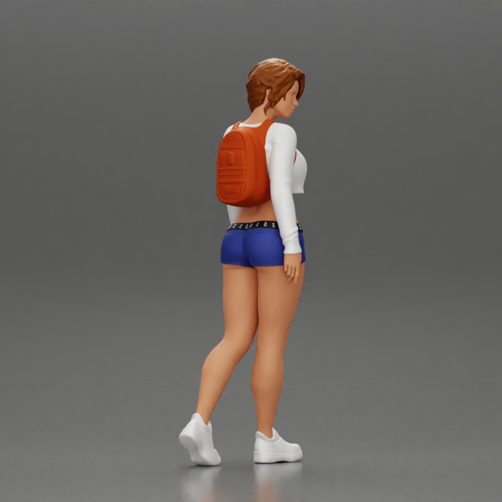 sexy girl walking in shorts and mini short and backpack image