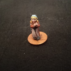 Picture of print of Fantasy miniatures for tabletop games. Scared child. Girl in the woods