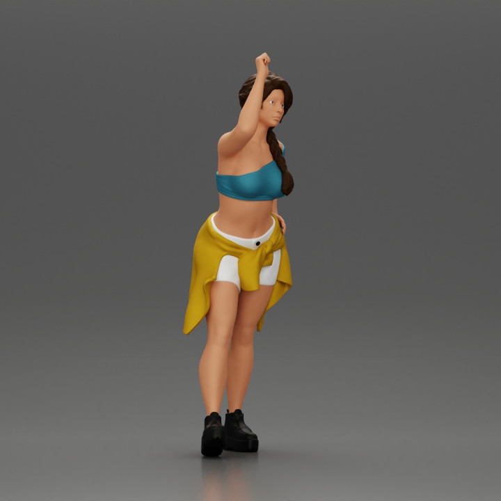 Fashionable Girl Wearing a Bra and shorts with Shirt Tied Around Her Hips image