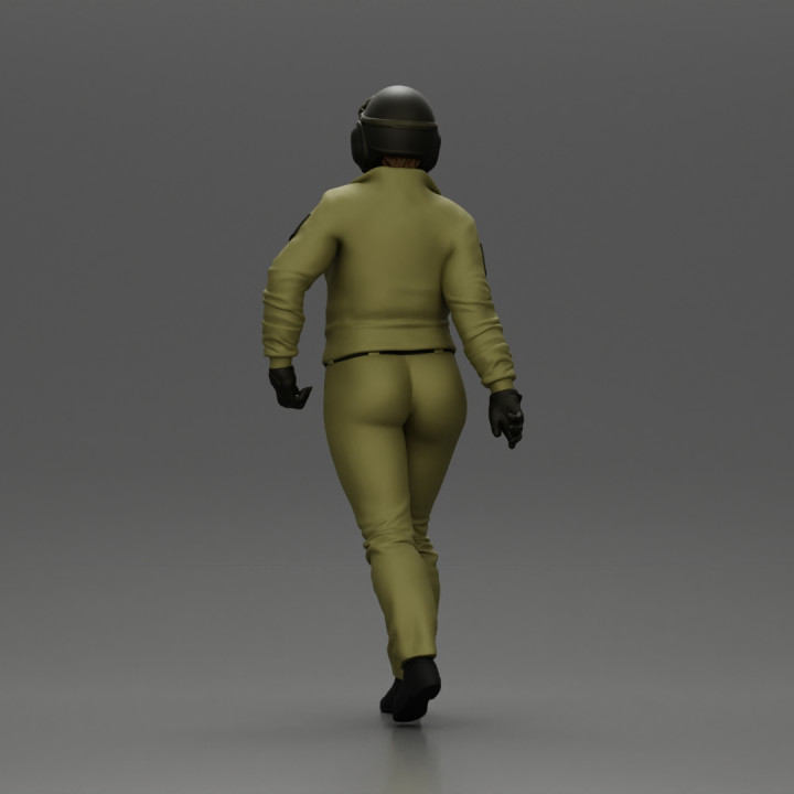Pilot Woman Walking with Military Helmet and Emergency Shoulder Bag image