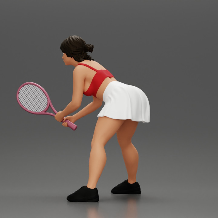 sexy tennis player in skirt holding her racket in a ready position image